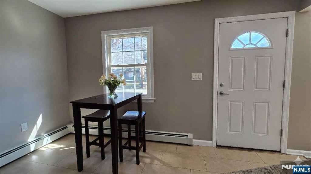 2-72 Saddle River Road Fair Lawn, NJ 07410 - Photo 4 of 33 a view of a dining room with furniture and chandelier