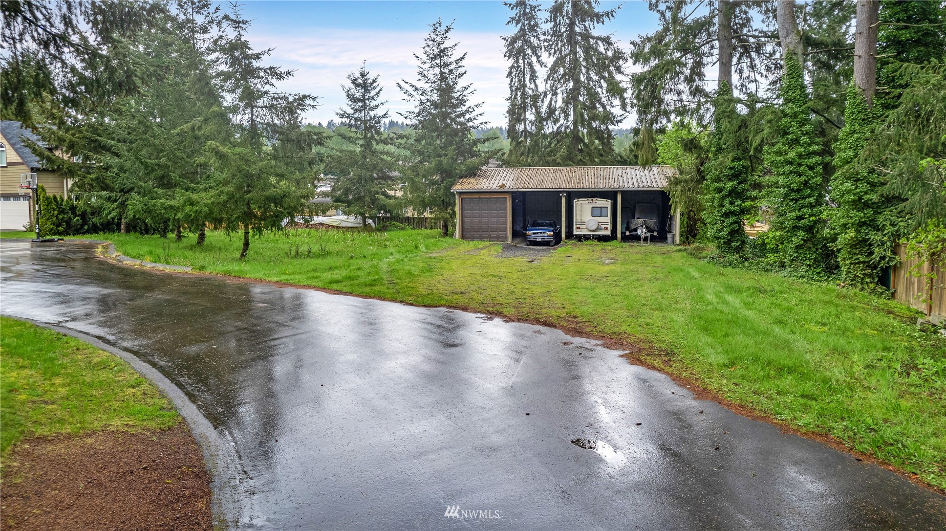 23231 Locust Way Bothell, WA 98021 - Photo 1 of 21 a view of a big house with a big yard and large trees