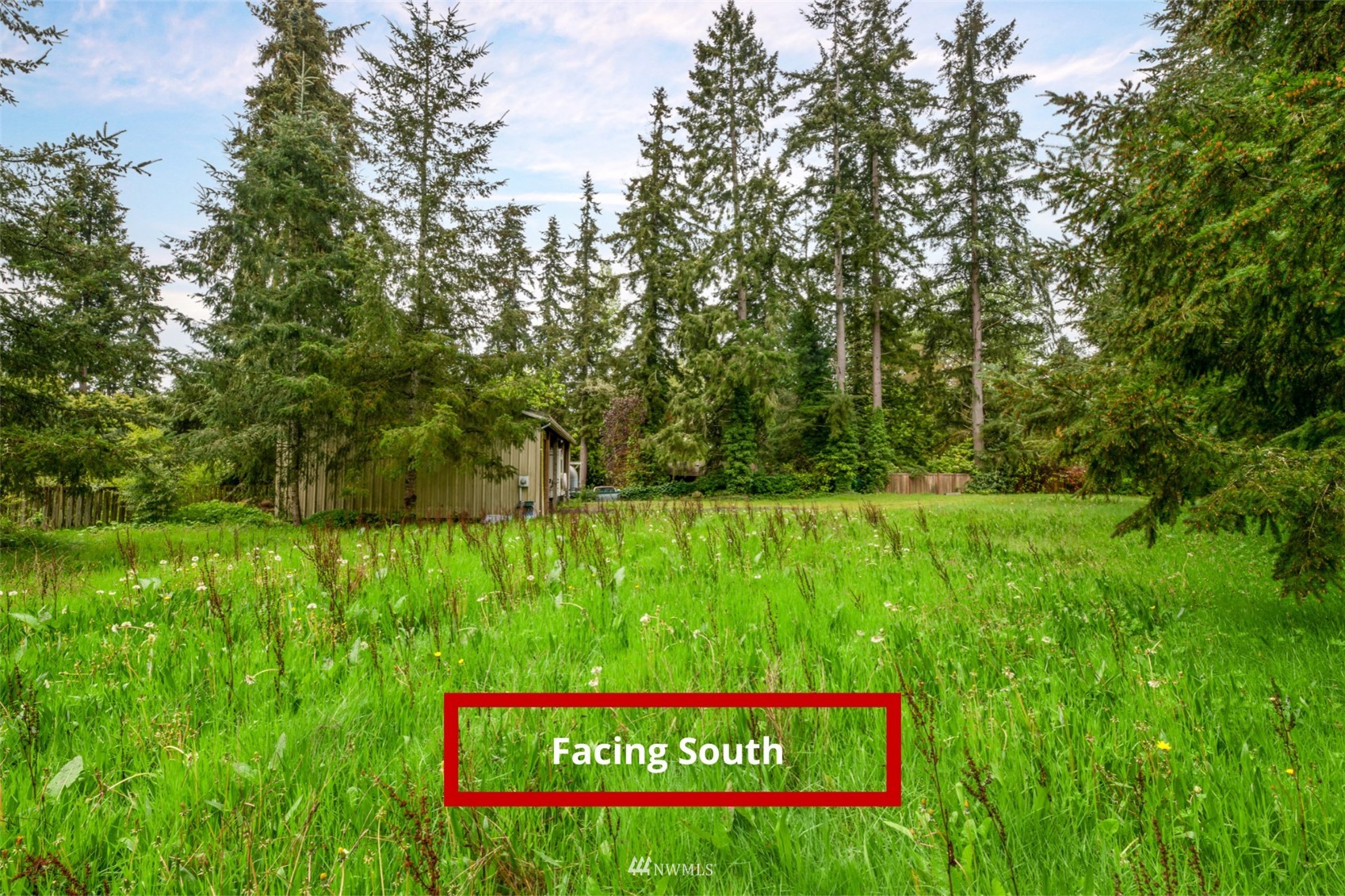 23231 Locust Way Bothell, WA 98021 - Photo 14 of 21 a sign that is sitting in the grass next to a road