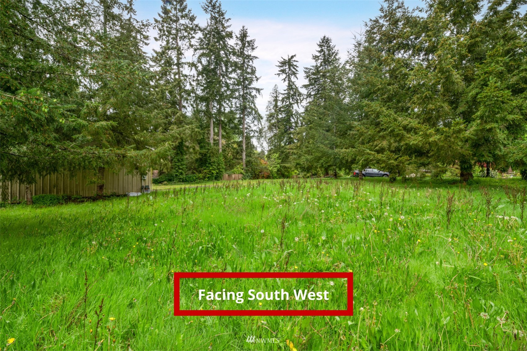 23231 Locust Way Bothell, WA 98021 - Photo 3 of 21 a sign that is sitting in the grass next to a road