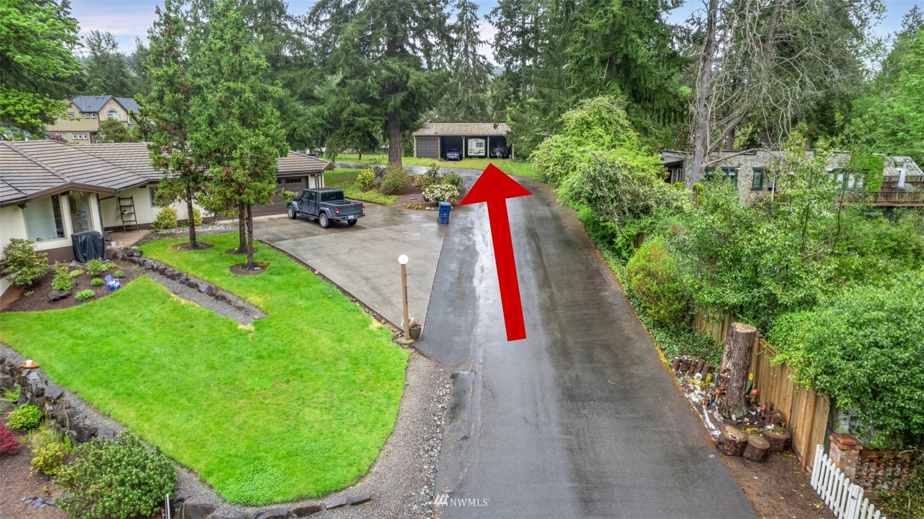 23231 Locust Way Bothell, WA 98021 - Photo 7 of 21 a view of a backyard with table and chairs a barbeque grill and plants