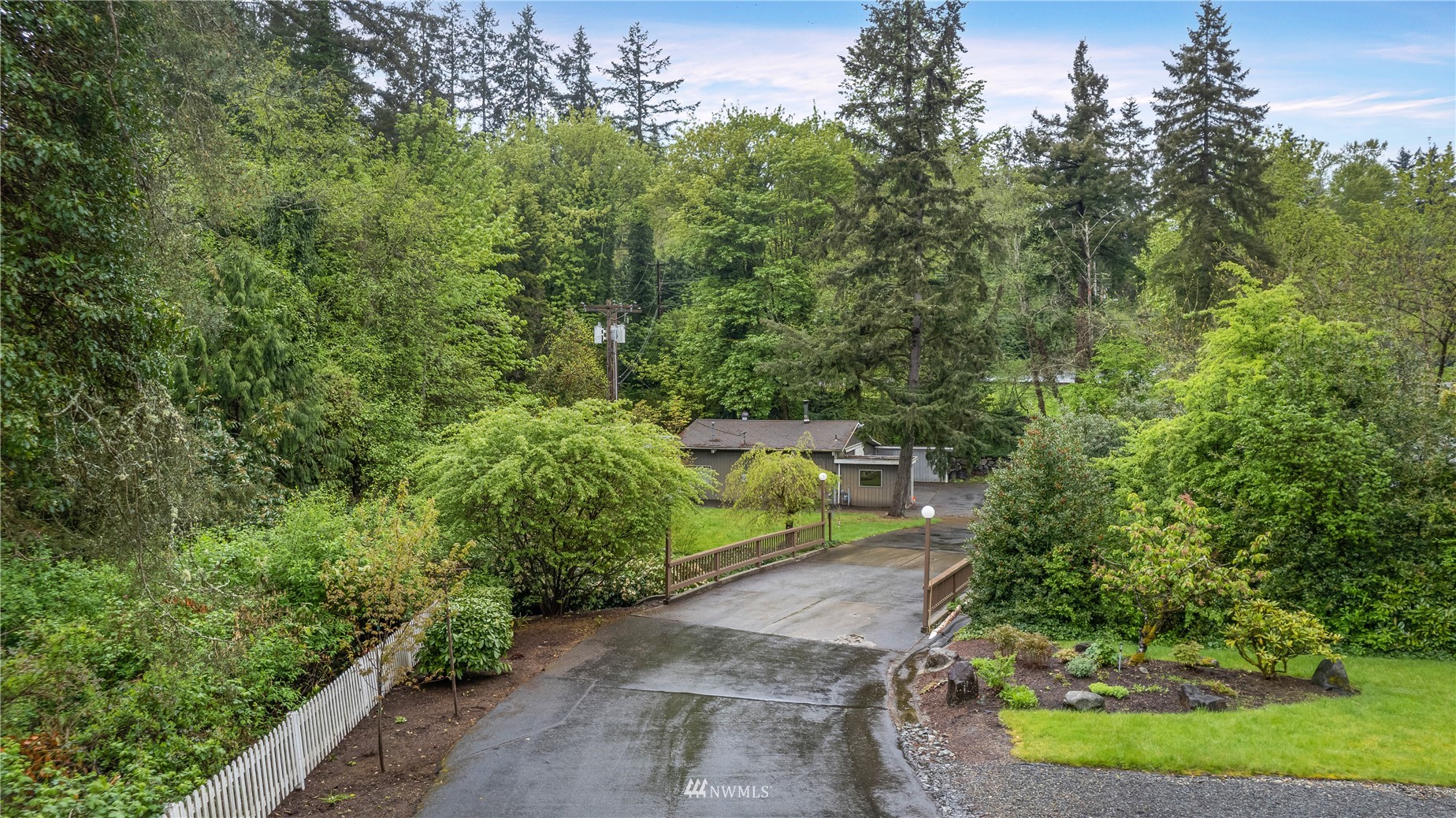 23231 Locust Way Bothell, WA 98021 - Photo 10 of 21 a view of a yard with plants and a small yard