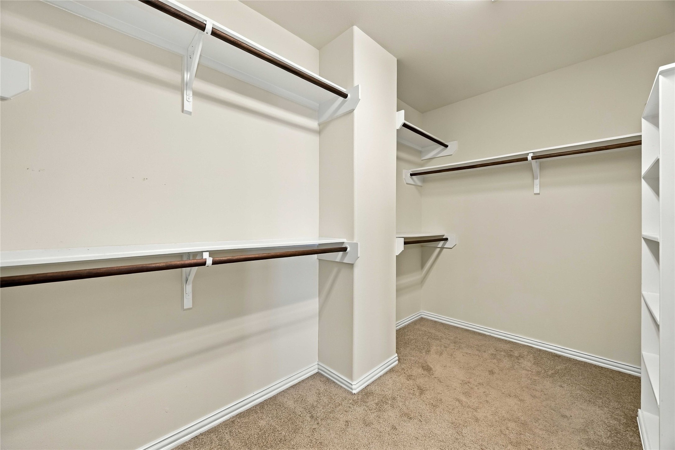 8338 Rudy Brook Way Spring, TX 77379 - Photo 22 of 33 A generous walk-in closet offers plenty of room for clothing, shoes, accessories, and everyday organization.
