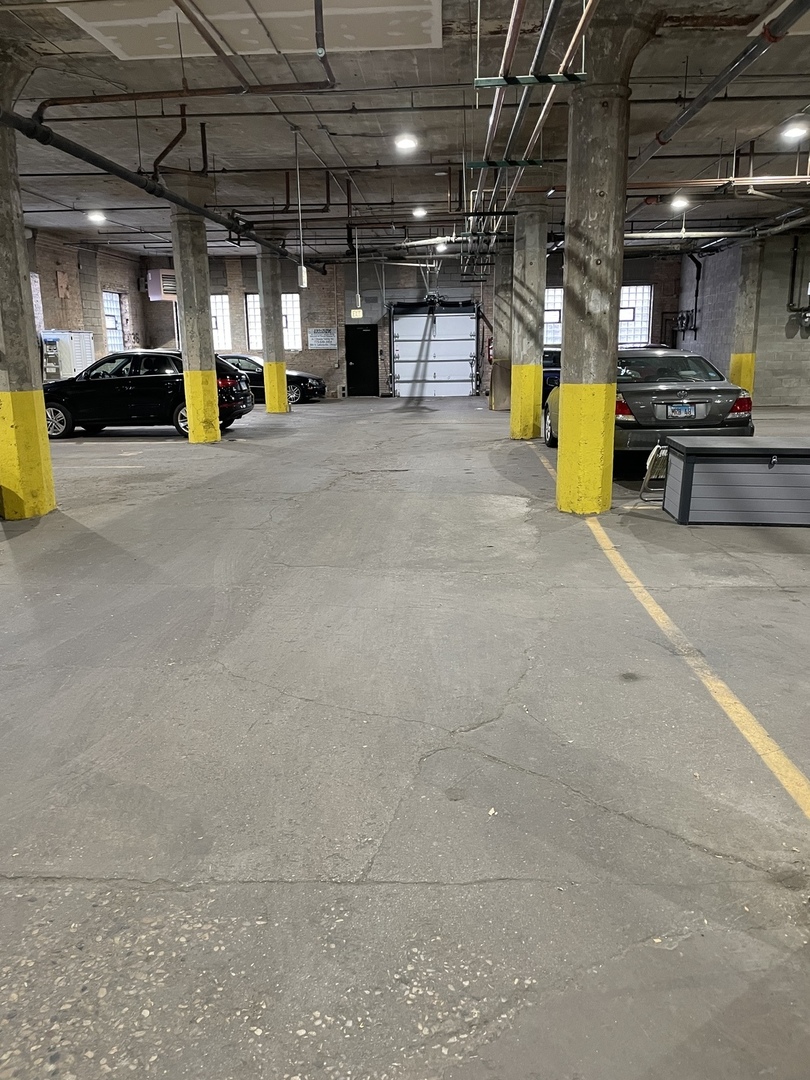 215 North Aberdeen Street, Unit 502B Chicago, IL 60607 - Photo 12 of 12 a view of a parking garage with a car parked