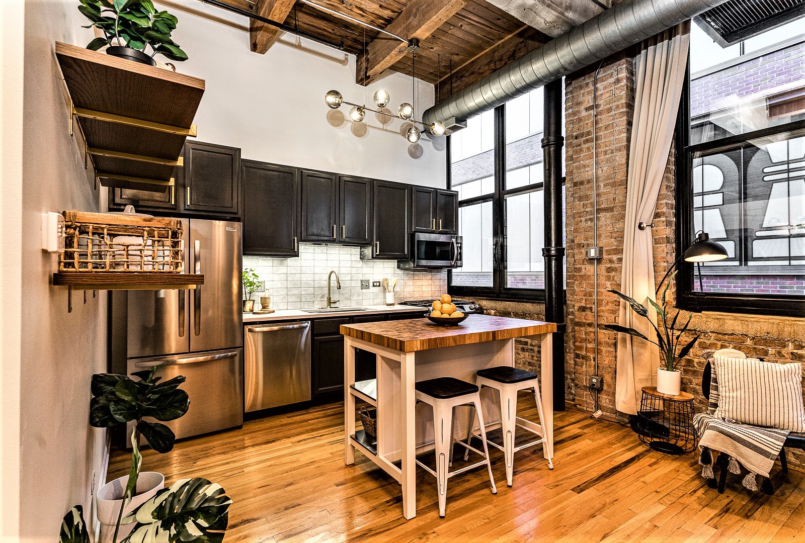 215 North Aberdeen Street, Unit 502B Chicago, IL 60607 - Photo 2 of 12 a living room with stainless steel appliances kitchen island granite countertop furniture and a kitchen view