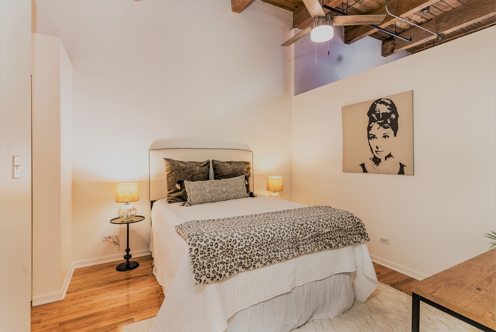 215 North Aberdeen Street, Unit 502B Chicago, IL 60607 - Photo 7 of 12 a bedroom with a bed and a window