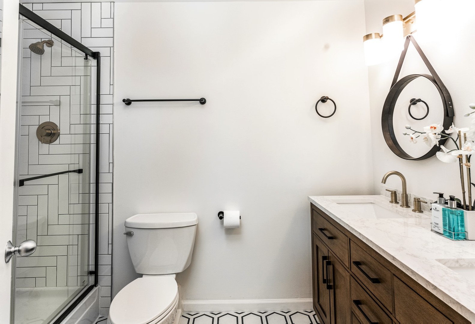 215 North Aberdeen Street, Unit 502B Chicago, IL 60607 - Photo 8 of 12 a bathroom with a granite countertop toilet sink and mirror