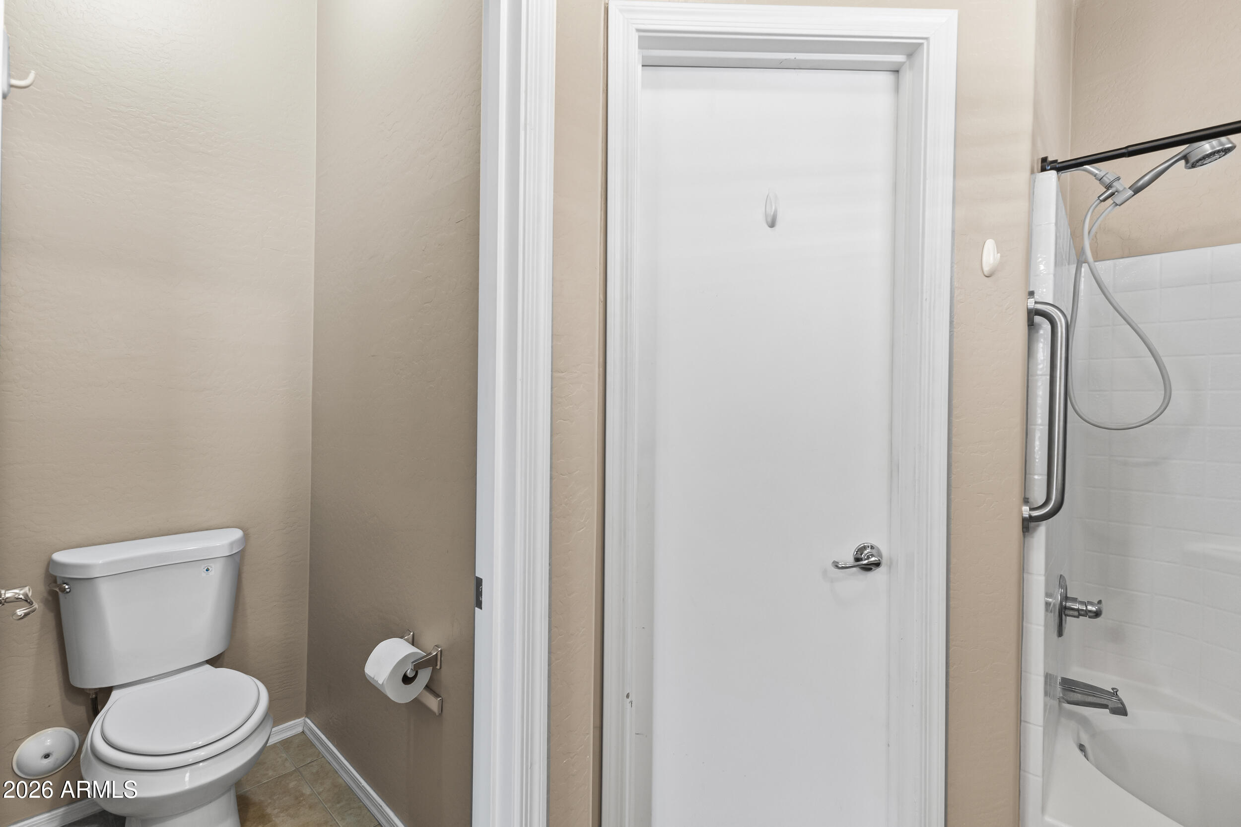 2150 East Bell Road, Unit 1140 Phoenix, AZ 85022 - Photo 10 of 21 a white toilet sitting next to a bathroom sink