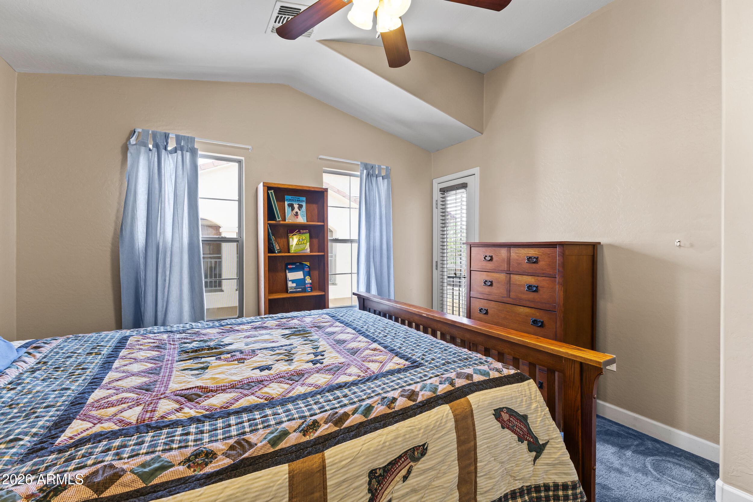 2150 East Bell Road, Unit 1140 Phoenix, AZ 85022 - Photo 11 of 21 a bedroom with a bed and dresser