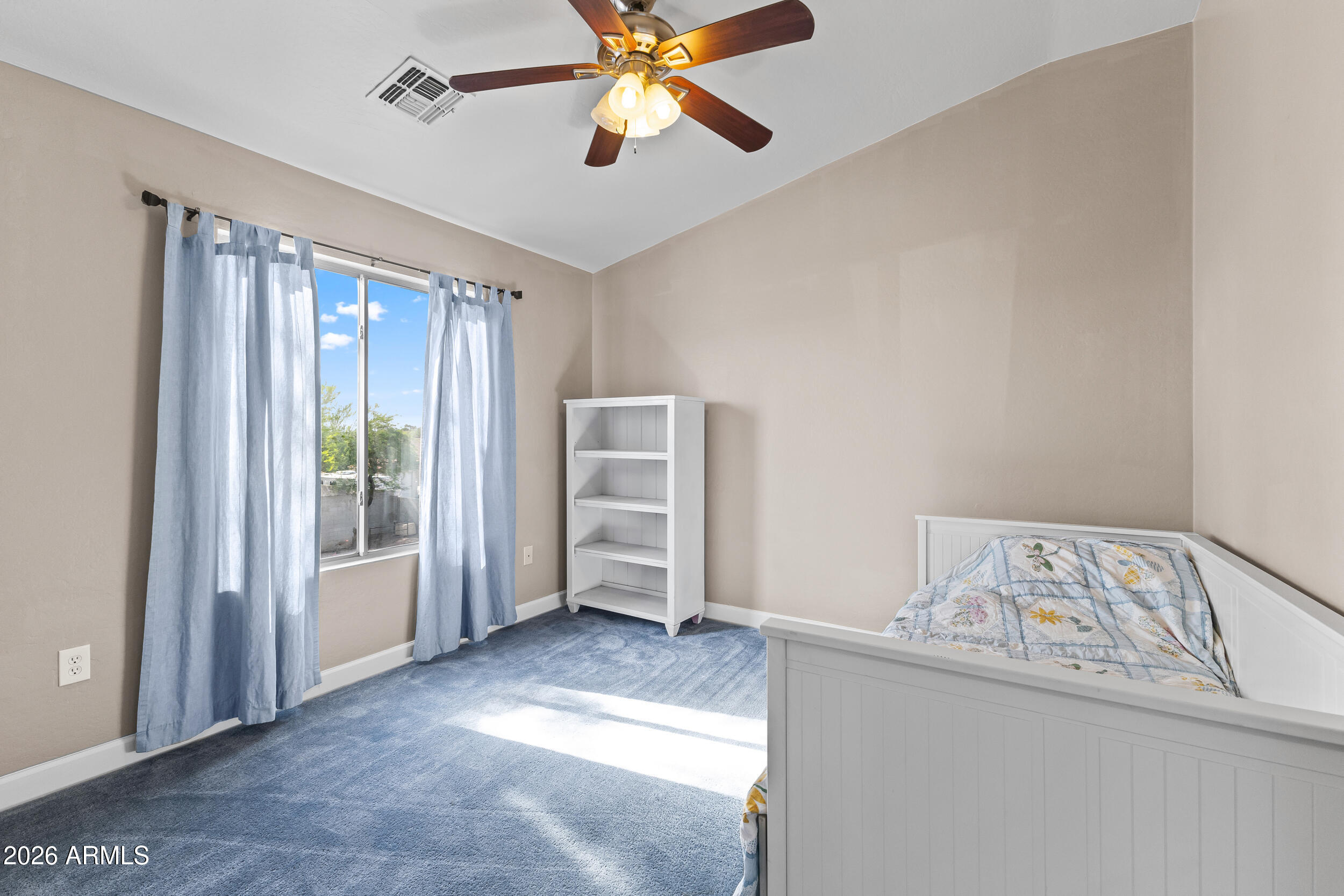 2150 East Bell Road, Unit 1140 Phoenix, AZ 85022 - Photo 12 of 21 a view of a bedroom with cabinet and windows