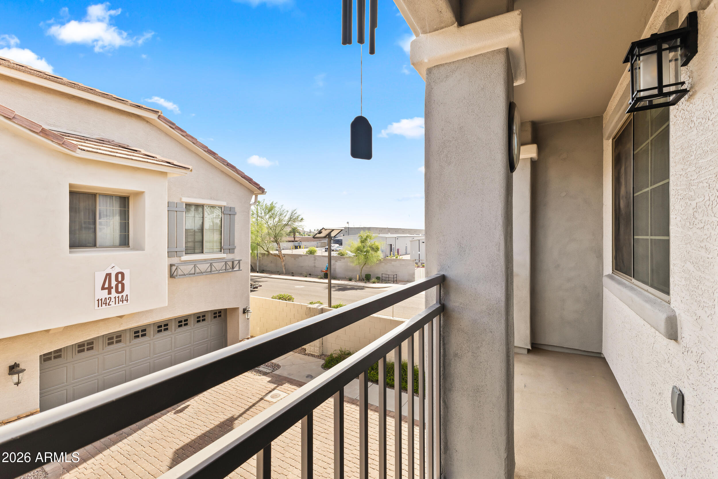 2150 East Bell Road, Unit 1140 Phoenix, AZ 85022 - Photo 15 of 21 a view of balcony and wooden floor
