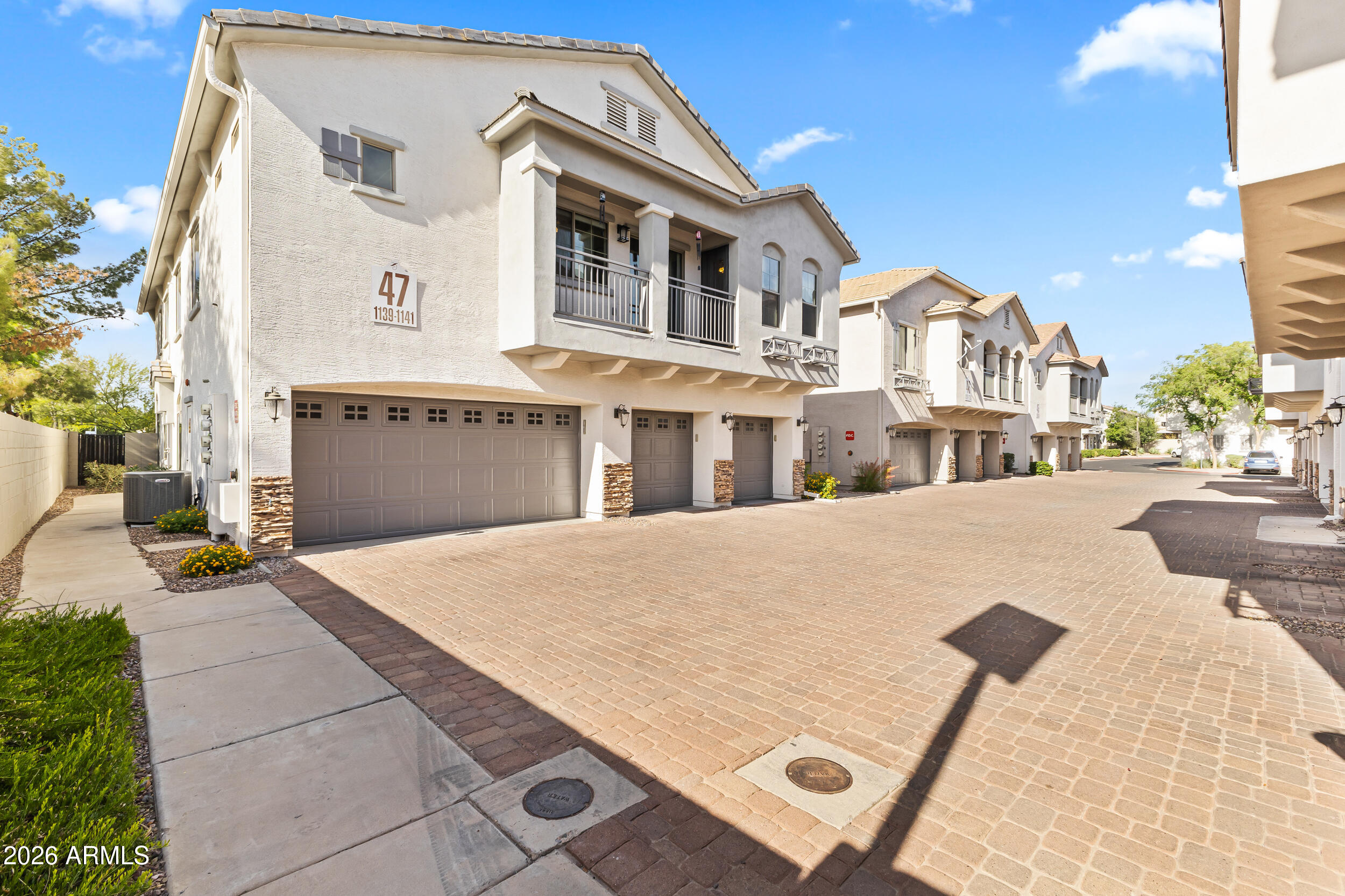 2150 East Bell Road, Unit 1140 Phoenix, AZ 85022 - Photo 17 of 21 a view of multiple houses with a street