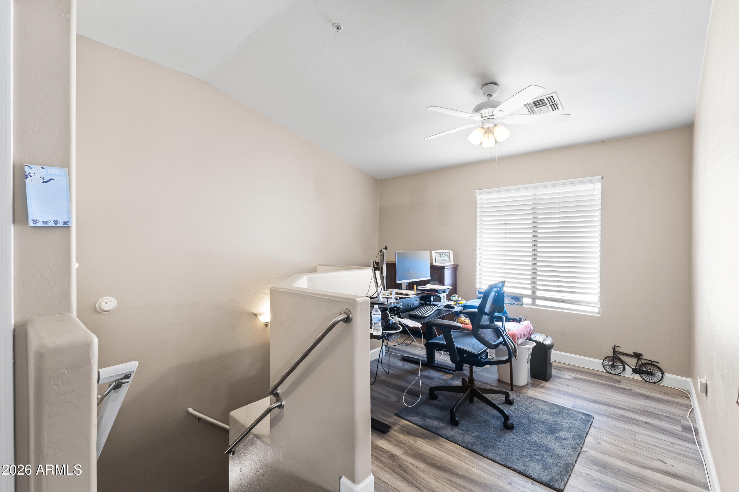 2150 East Bell Road, Unit 1140 Phoenix, AZ 85022 - Photo 18 of 21 a view of a livingroom with workspace and a window
