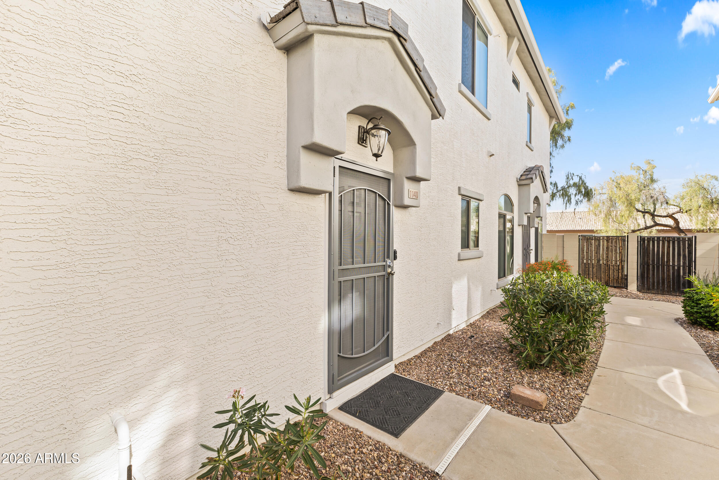 2150 East Bell Road, Unit 1140 Phoenix, AZ 85022 - Photo 20 of 21 a view of a back yard of the house