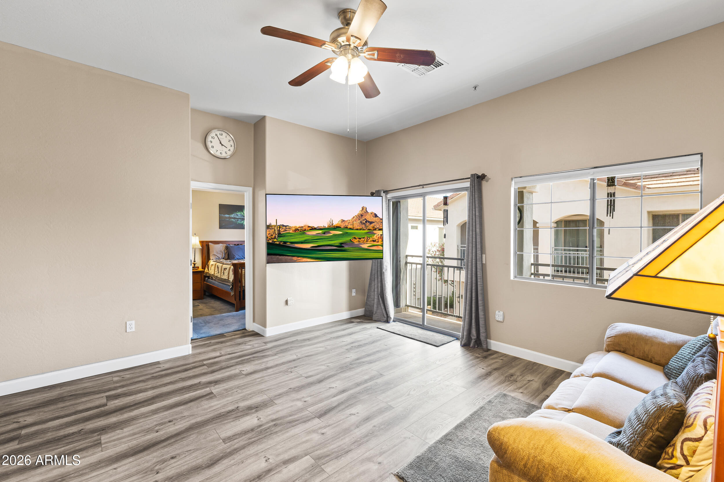 2150 East Bell Road, Unit 1140 Phoenix, AZ 85022 - Photo 6 of 21 a living room with furniture and a window