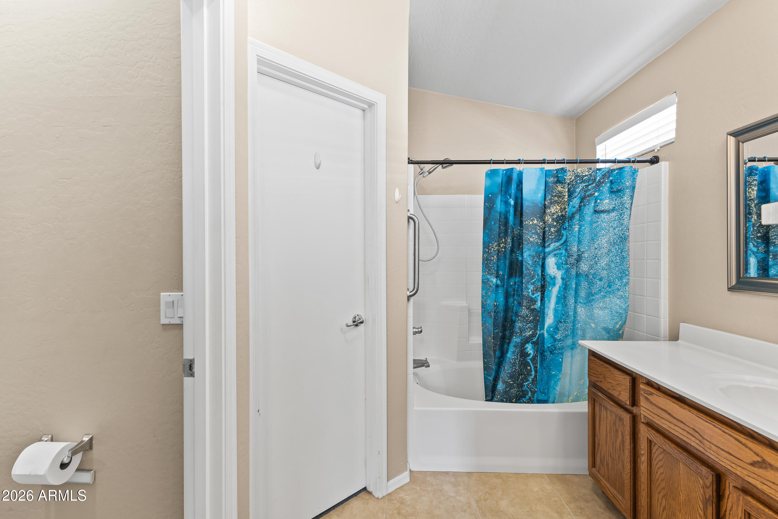 2150 East Bell Road, Unit 1140 Phoenix, AZ 85022 - Photo 9 of 21 a bathroom with a bathtub a sink and a shower