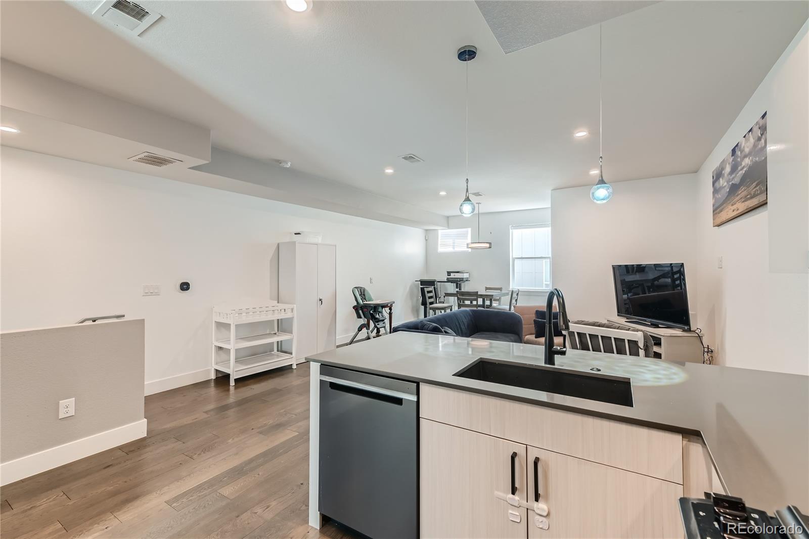 1284 Stuart Street Denver, CO 80204 - Photo 14 of 43 a kitchen with counter top space cabinets and appliances
