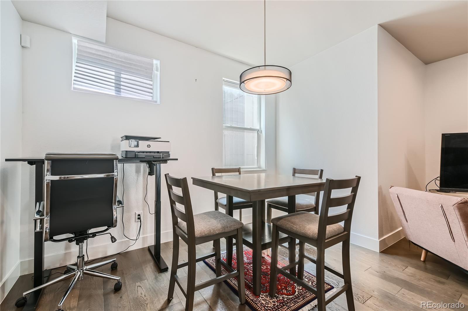 1284 Stuart Street Denver, CO 80204 - Photo 19 of 43 a view of a dining room with furniture and wooden floor
