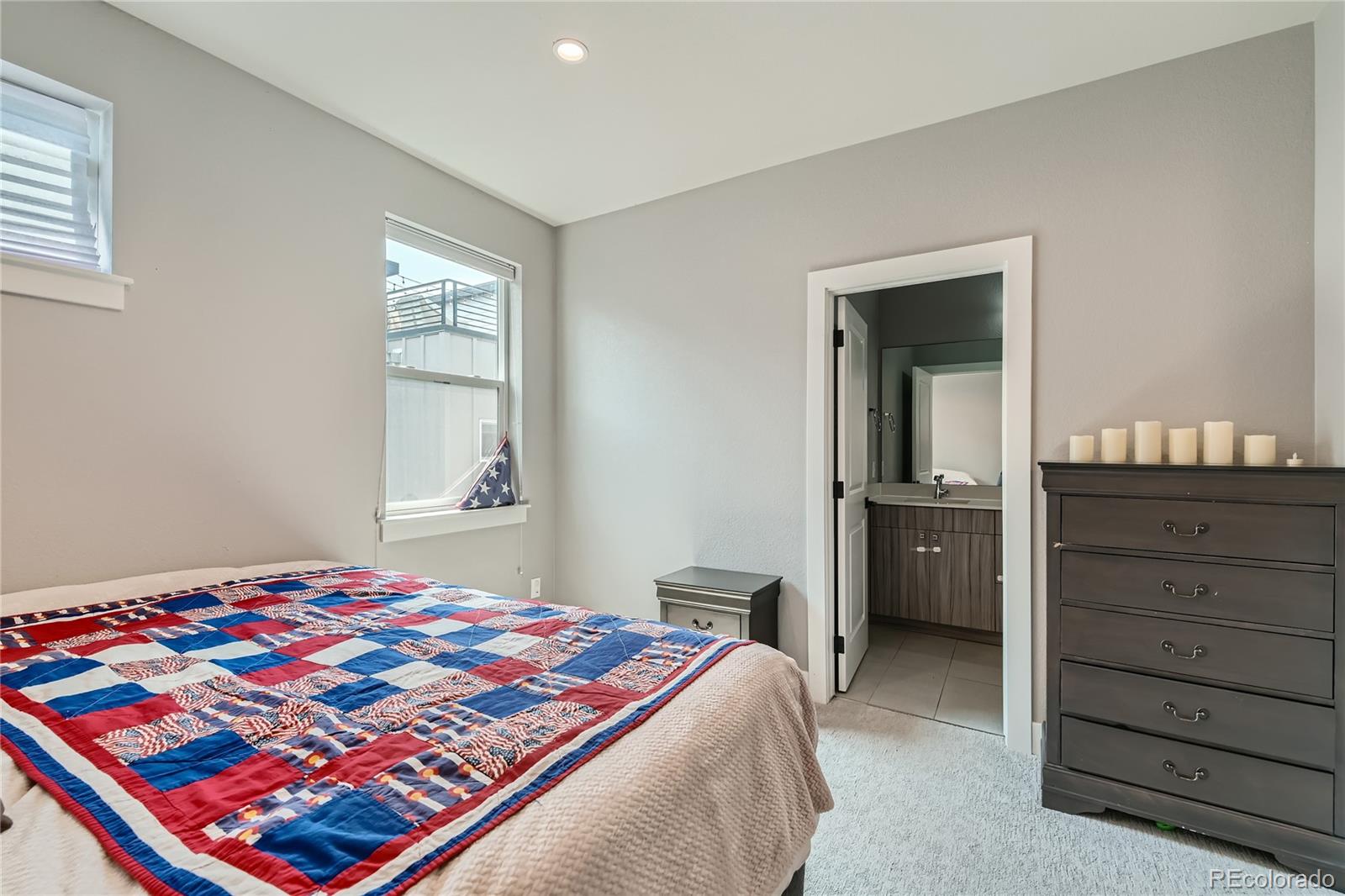 1284 Stuart Street Denver, CO 80204 - Photo 21 of 43 a bedroom with a bed and a dresser