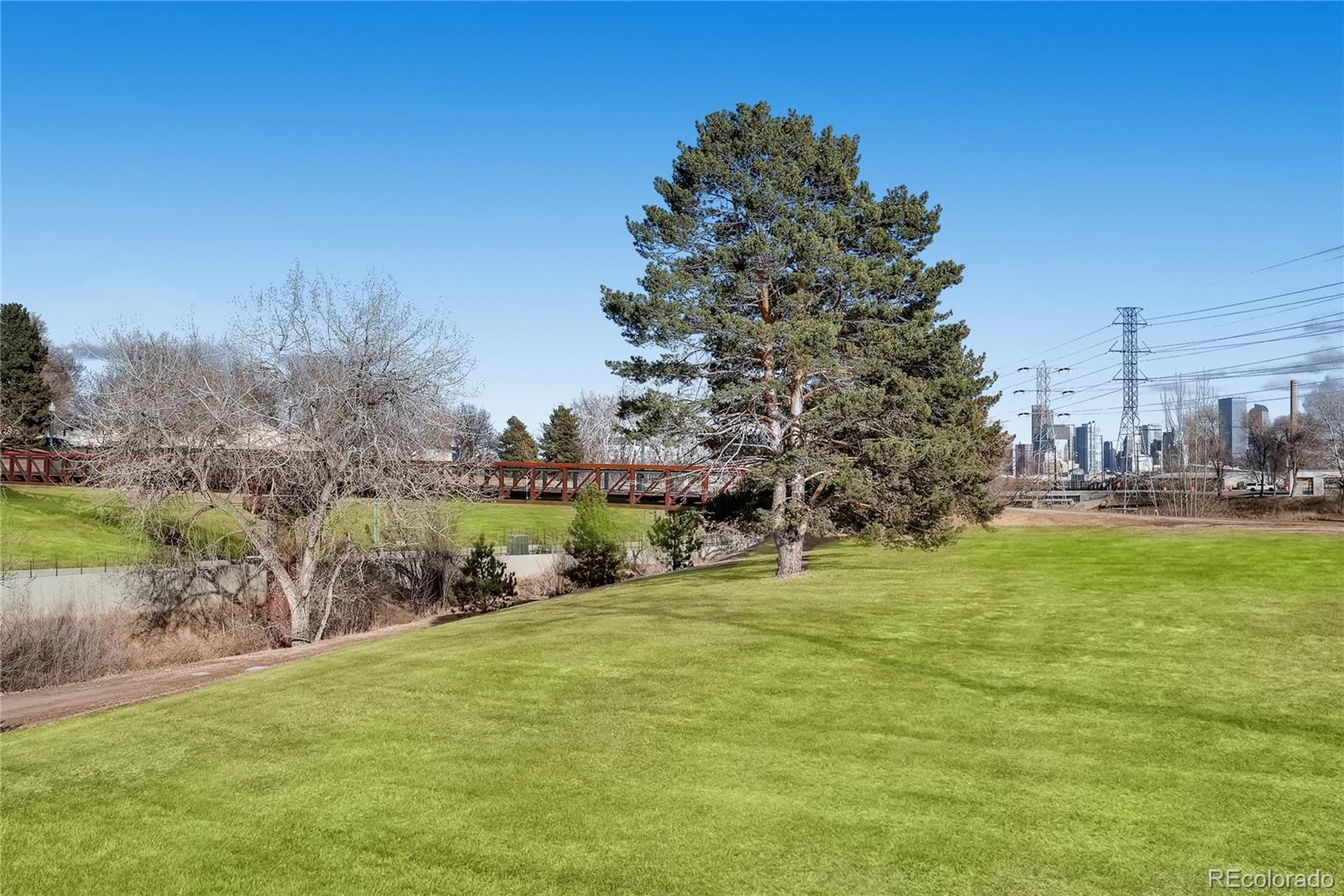 1284 Stuart Street Denver, CO 80204 - Photo 38 of 43 a swimming pool with trees in the background