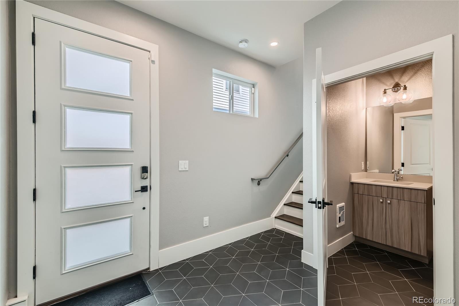 1284 Stuart Street Denver, CO 80204 - Photo 5 of 43 a view of entryway and hall with wooden floor