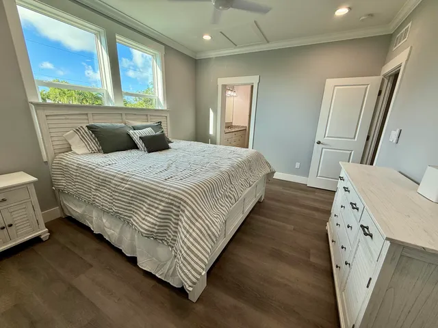 a bedroom with a bed and window