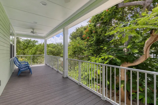 a view of a balcony with wooden floor