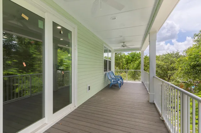 a view of a chair and table in the balcony