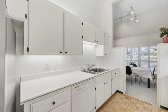 a kitchen with a sink and cabinets