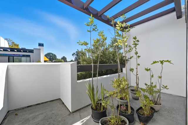 a view of a chairs and table in a patio