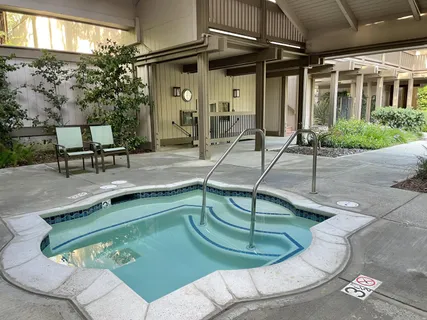a view of a swimming pool with chairs