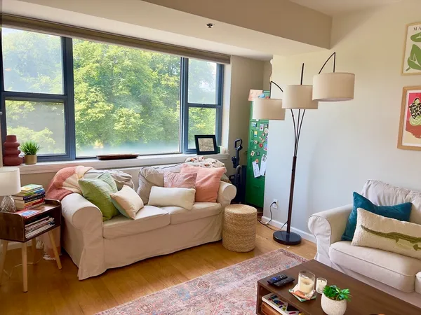 a living room with furniture and a large window