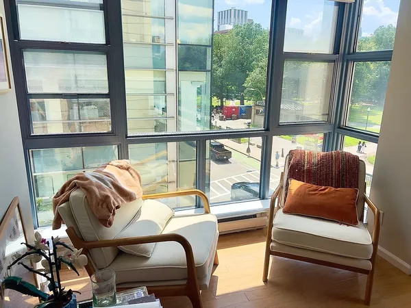 a bedroom with furniture and a window