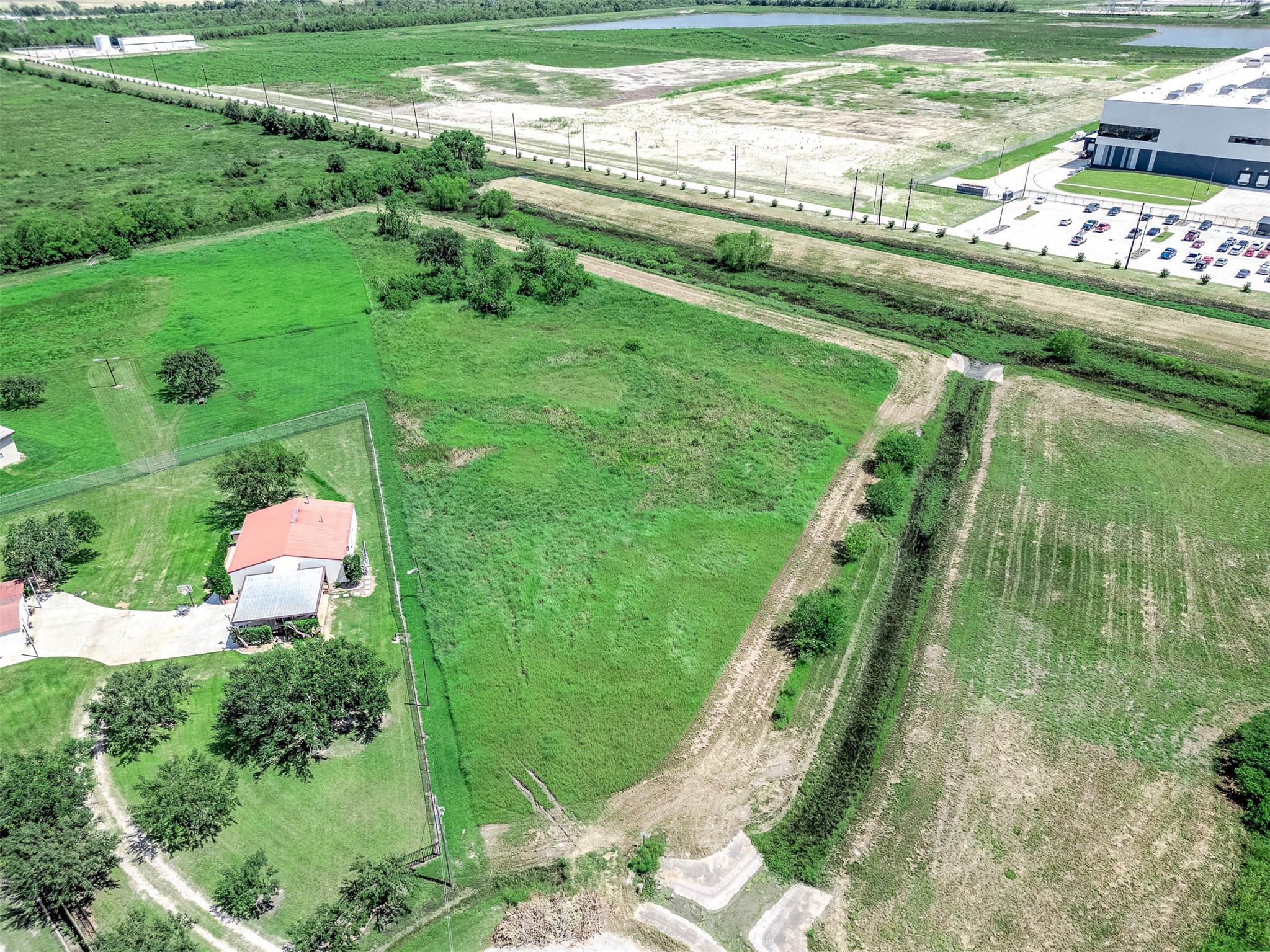 14411 Austin Bayou Drive Rosharon, TX 77583 - Photo 2 of 15 a view of a garden with a lake view
