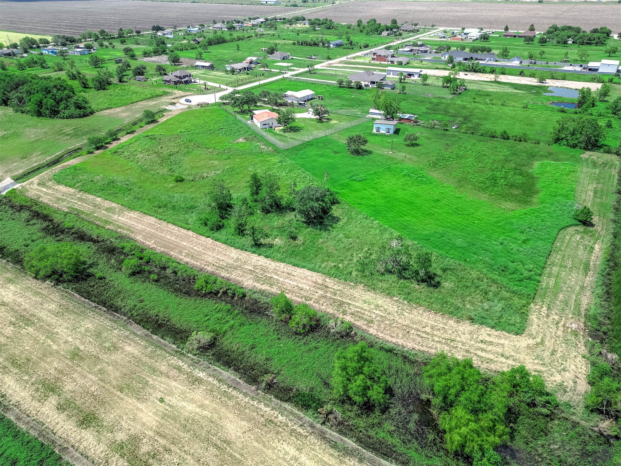 14411 Austin Bayou Drive Rosharon, TX 77583 - Photo 9 of 15 a view of a garden with a building in the background