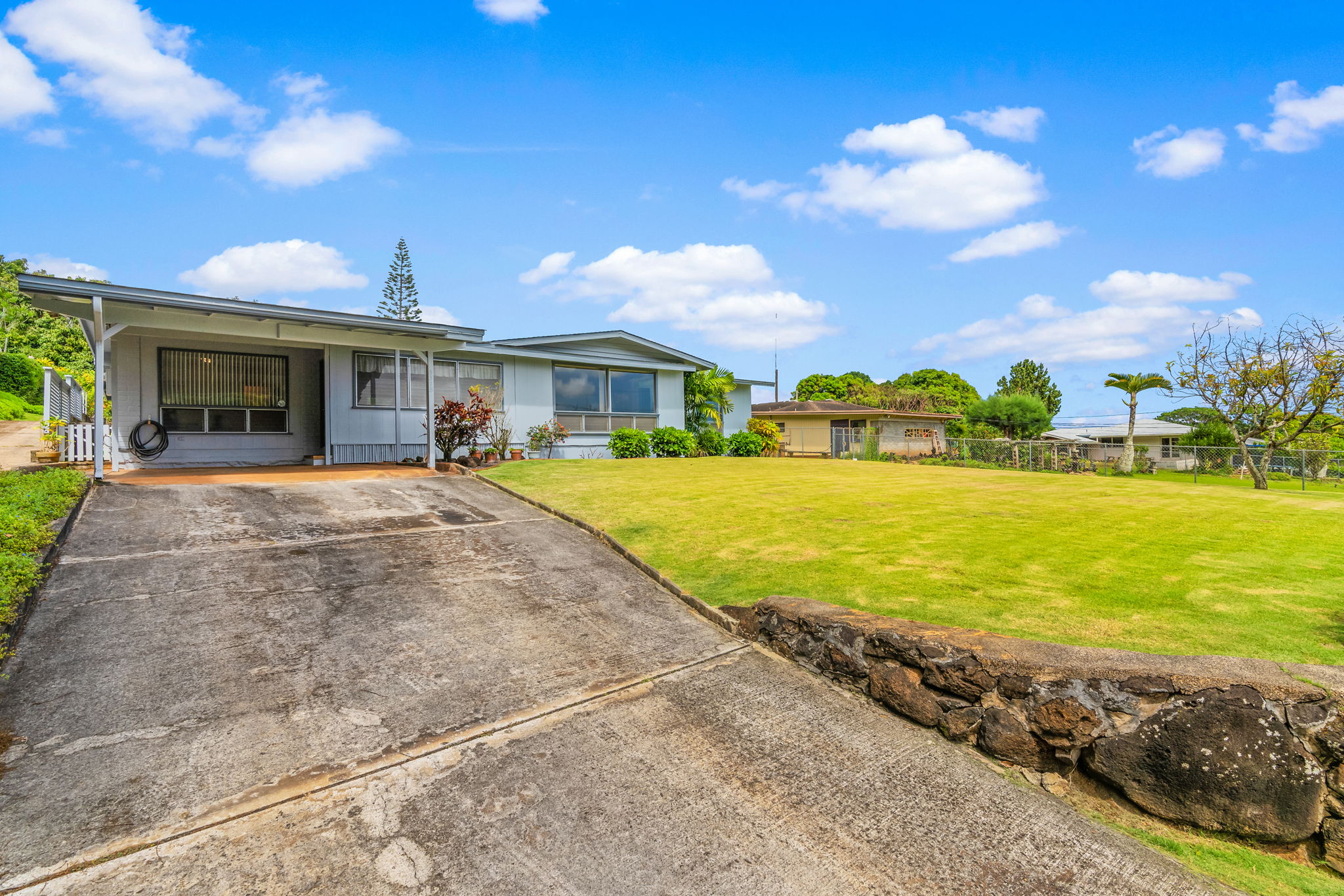 5318 Kihei Road Kapaa, HI 96746 - Photo 1 of 1 a view of a house with swimming pool and a yard
