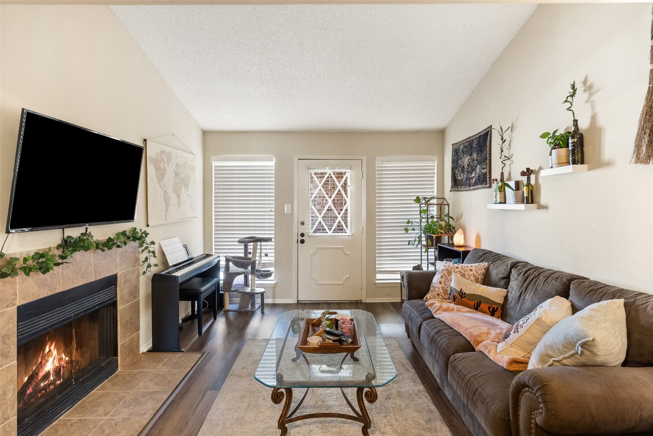 a living room with furniture and a flat screen tv