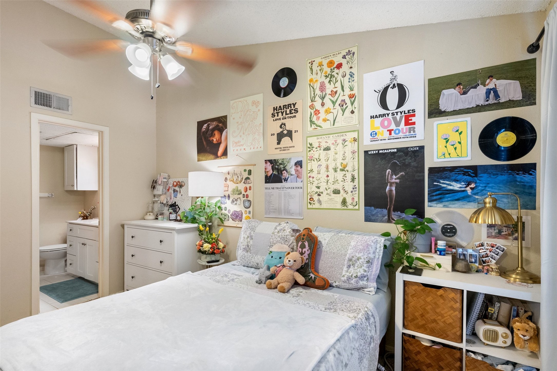 806 West 24th Street, Unit 328 Austin, TX 78705 - Photo 14 of 21 a bedroom with a bed and a bookshelf