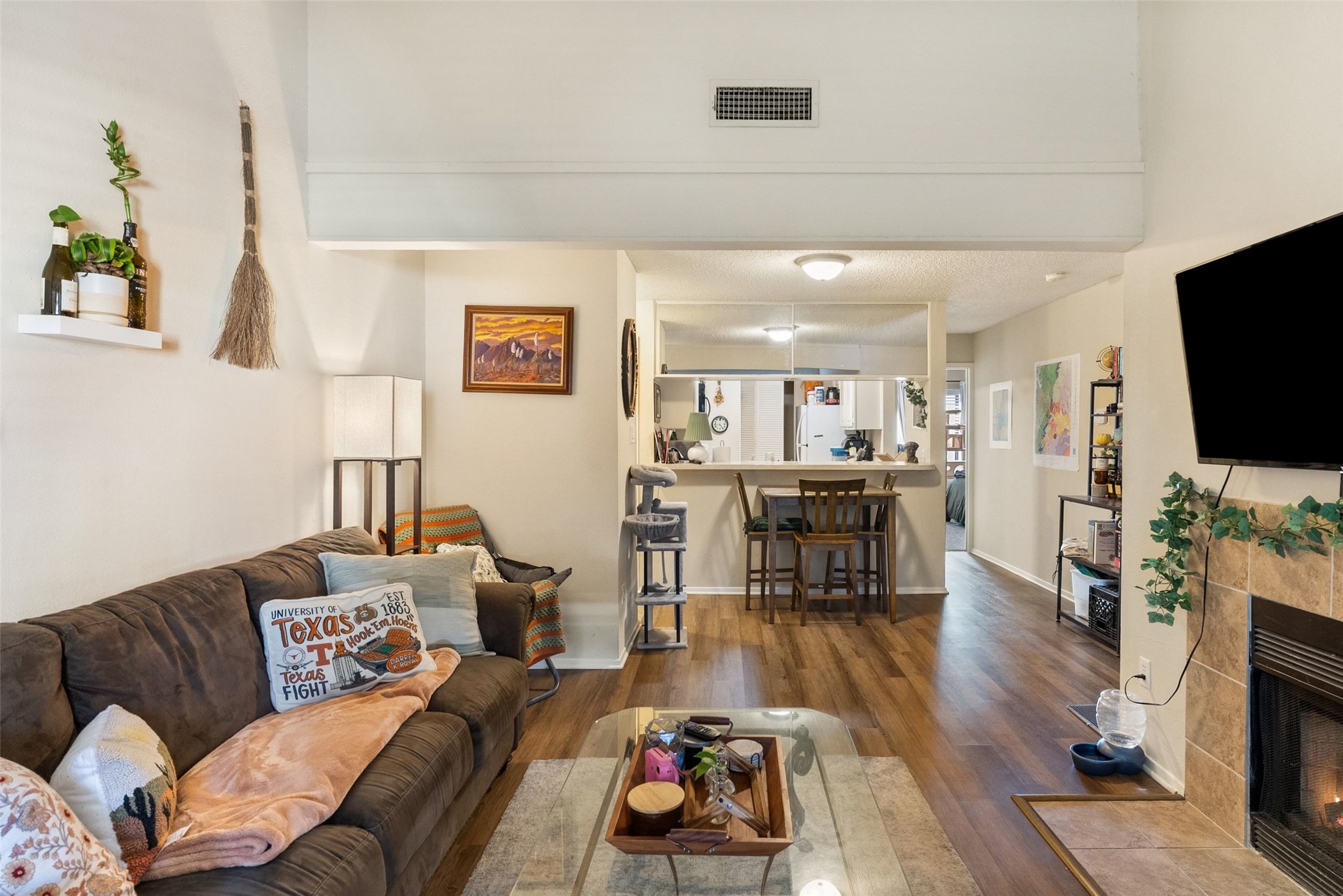 806 West 24th Street, Unit 328 Austin, TX 78705 - Photo 3 of 21 a living room with furniture and a flat screen tv