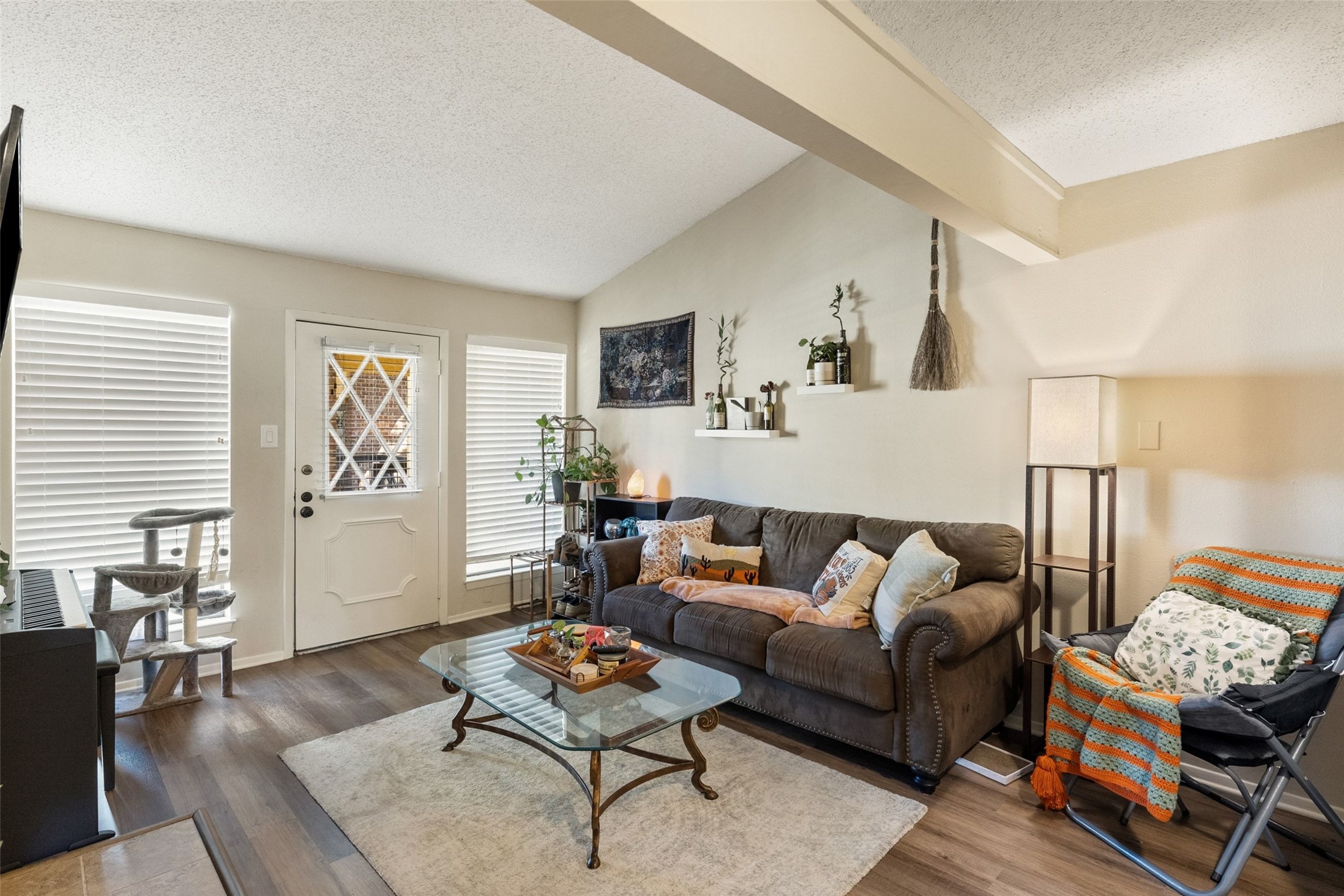 806 West 24th Street, Unit 328 Austin, TX 78705 - Photo 6 of 21 a living room with furniture and a wooden floor