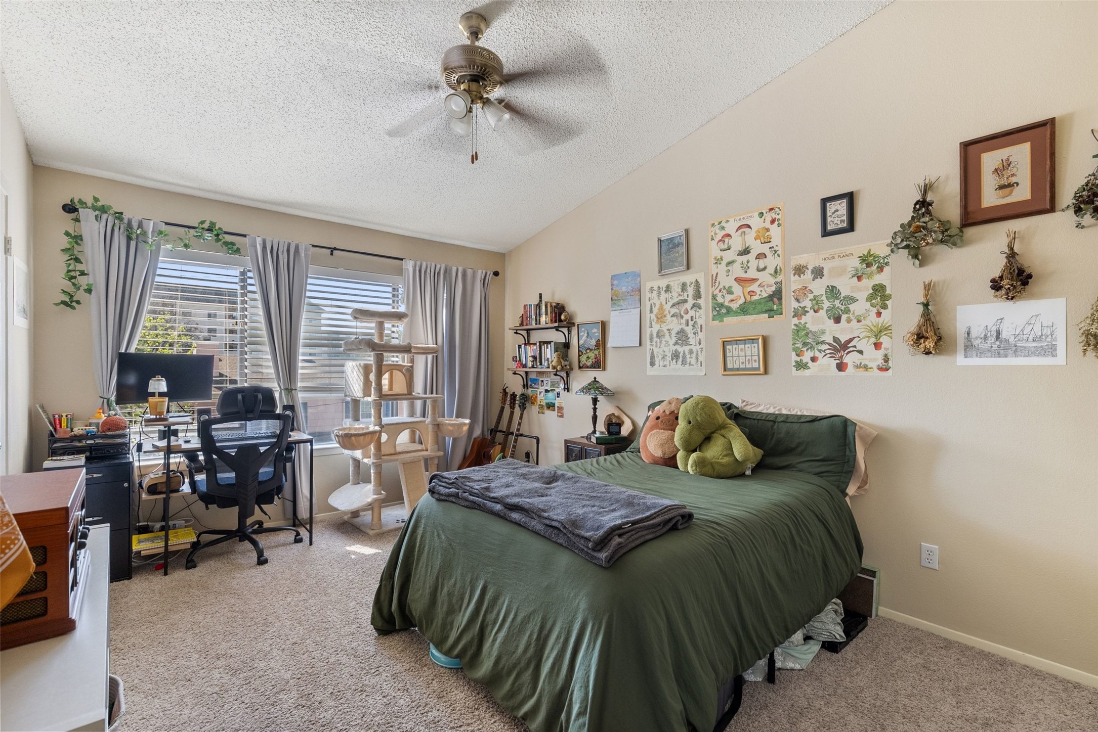 806 West 24th Street, Unit 328 Austin, TX 78705 - Photo 9 of 21 a bedroom with a bed lamps and chairs