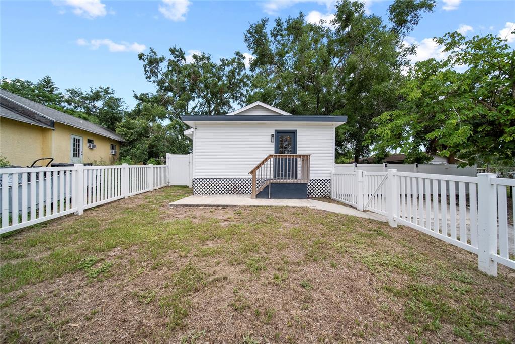 4622 Paloverde Drive New Port Richey, FL 34652 - Photo 1 of 22 a house with trees in the background