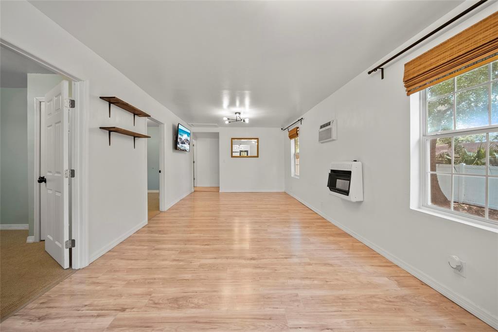 4622 Paloverde Drive New Port Richey, FL 34652 - Photo 11 of 22 a big room with wooden floor and windows