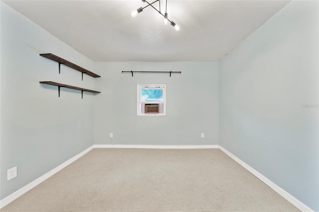 4622 Paloverde Drive New Port Richey, FL 34652 - Photo 14 of 22 an empty room with windows