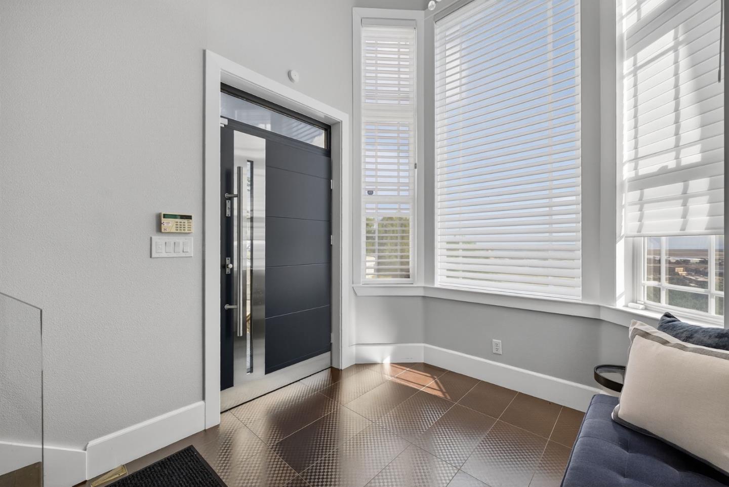 58 Hillcrest Road San Carlos, CA 94070 - Photo 11 of 105 a view of an empty room with a window and wooden floor