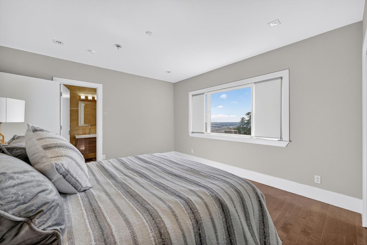 58 Hillcrest Road San Carlos, CA 94070 - Photo 71 of 105 a bedroom with a bed and a painting on the wall