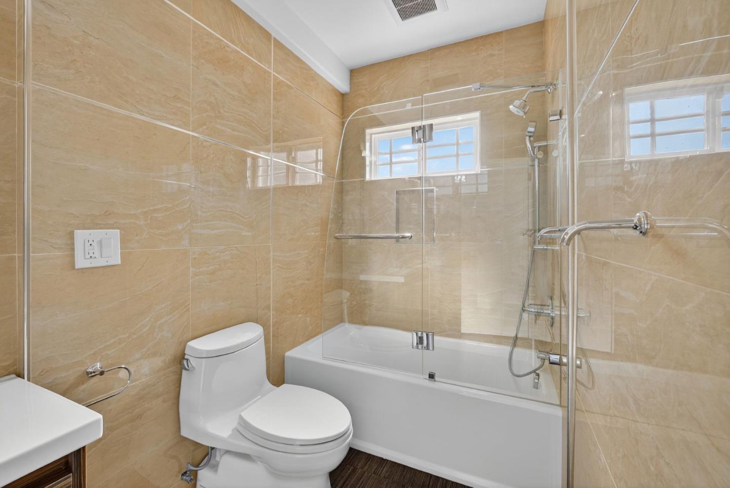 58 Hillcrest Road San Carlos, CA 94070 - Photo 76 of 105 a white toilet sitting next to a bath tub