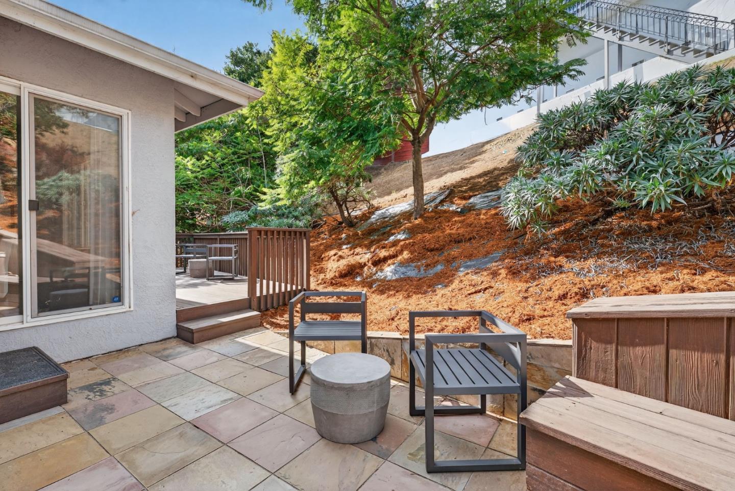 58 Hillcrest Road San Carlos, CA 94070 - Photo 92 of 105 a view of a patio with couple of chairs and a fire pit