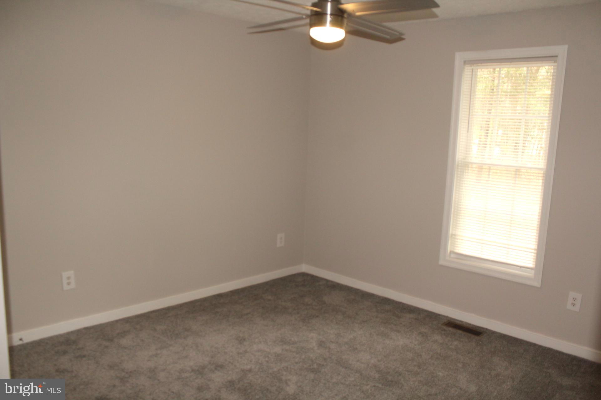 9448 Ladysmith Road Ruther Glen, VA 22546 - Photo 33 of 41 Bedroom two. Features new carpeting
