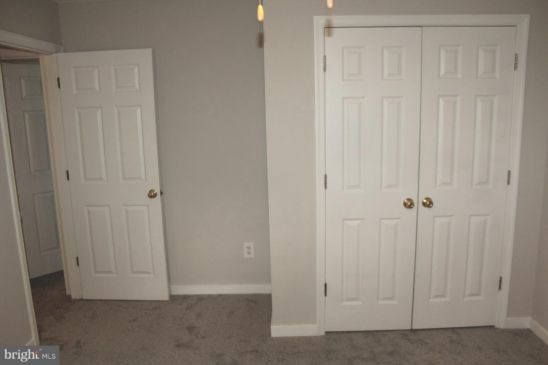 9448 Ladysmith Road Ruther Glen, VA 22546 - Photo 34 of 41 Bedroom two. Features new ceiling fan.